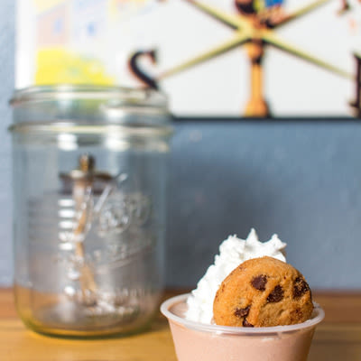 Mad Hanna chocolate-Guinness pudding shot with whipped cream and a tiny chocolate chip cookie