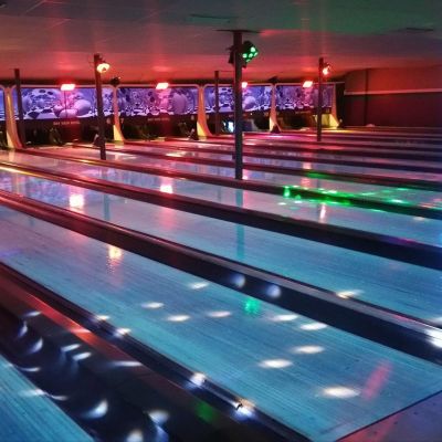 Bowling lanes with lighting.