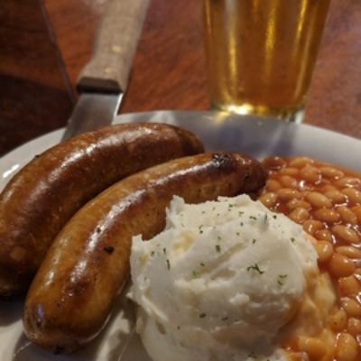 Bangers & Mash, sausage, beans and mashed potatoes closeup