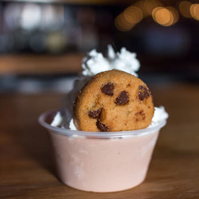 Mad Hanna cookies-n-cream pudding shot with whipped cream and a tiny chocolate chip cookie