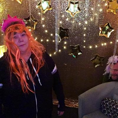 A guest with an orange wig