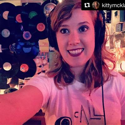 Selfie of a woman DJing in the DJ booth