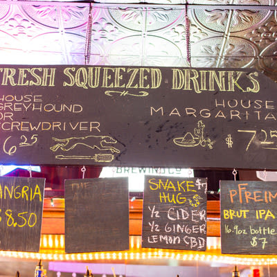 Chalkboard menu of fresh squeezed drinks at Mad Hanna