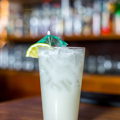 Cocktail served, bar in the back