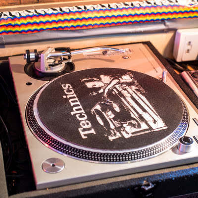 a turntable in the DJ booth at Mad Hanna