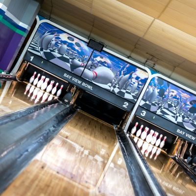Bowling lanes with bowling pins in place.
