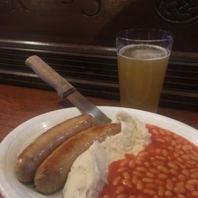 Banger's & Mash, sausages, mashed potatoes, beans and a glass of beer