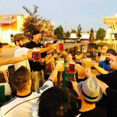 Oktoberfest crowd raising beer steins