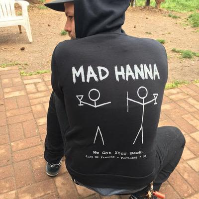 A Mad Hanna bartender posing in a Mad Hanna - We Got Your Back - hoodie.
