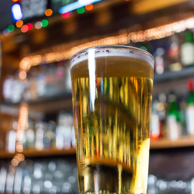 a properly poured pint of a golden lager