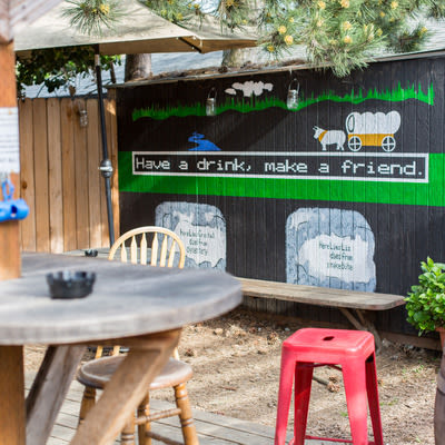 Mad Hanna patio with table and Oregon Trail Inspired mural