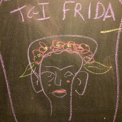 A funny drawing of Frida Kahlo on the blackboard