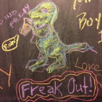 A drawing of a dinosaur on the blackboard