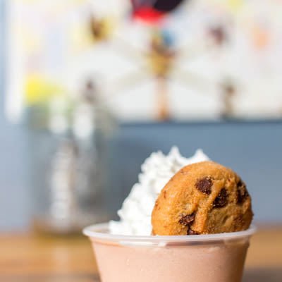Mad Hanna mocha-coconut pudding shot with whipped cream and a tiny chocolate chip cookie