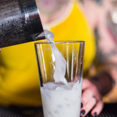 A bartender making the cocktail