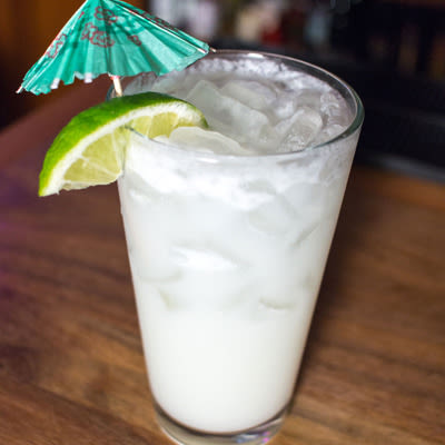 A glass of white cocktail