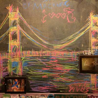 an example of colorful chalk-art drawn on the walls in the bathrooms at Mad Hanna.